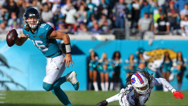 Jacksonville Jaguars quarterback Trevor Lawrence (16) scrambles away from Buffalo Bills linebacker Tremaine Edmunds (49) during third quarter action. The Jaguars were tied with the Bills 6 to 6 at the end of the first half and went on to win the game with a final score of 9 to 6. The Jacksonville Jaguars hosted the Buffalo Bills at TIAA Bank Field in Jacksonville, FL, Sunday, November 7, 2021. [Bob Self/Florida Times-Union]

Jki 110721 Bsjagsvsbuffalo 5